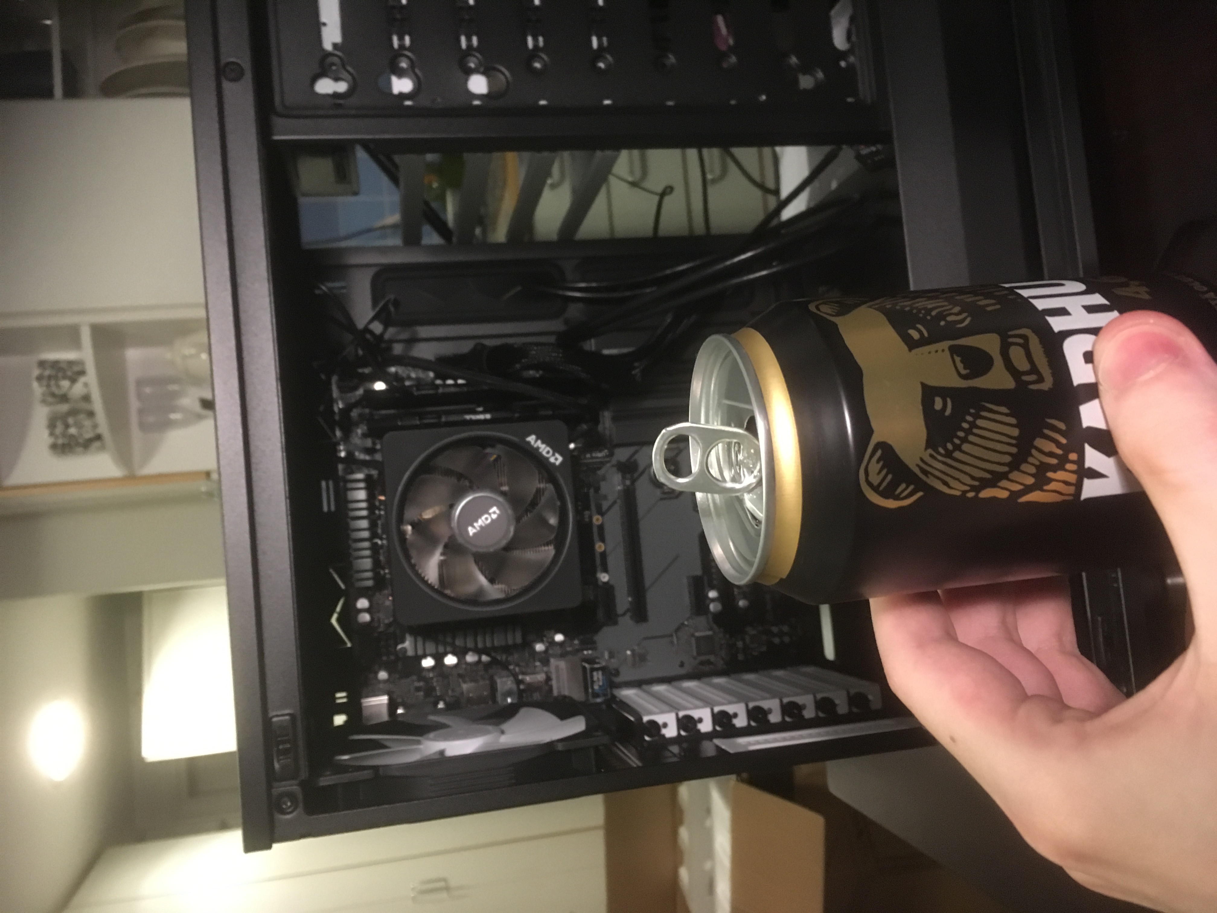 half-built PC and a can of beer