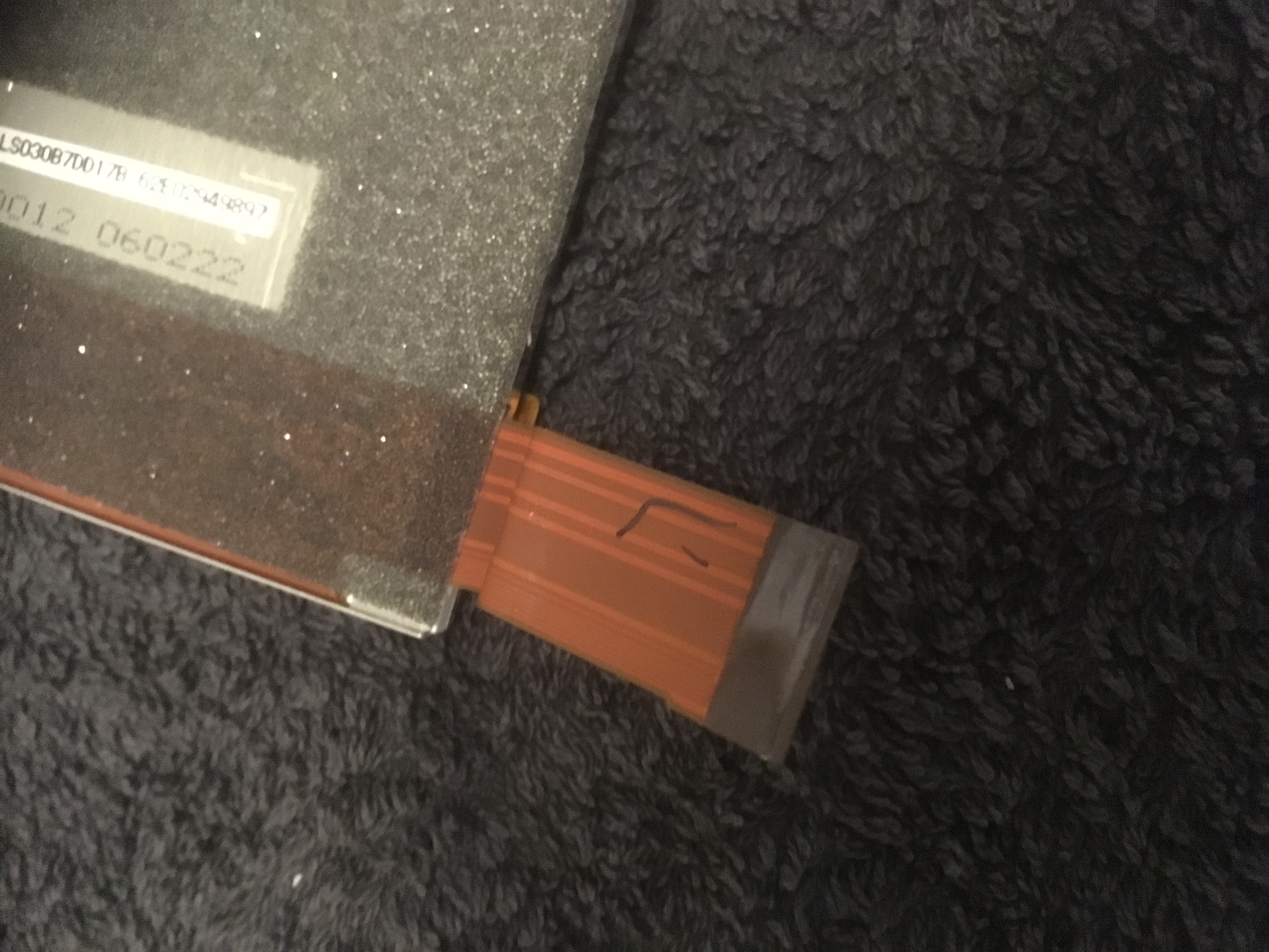 black marker on the bottom screen's ribbon cable