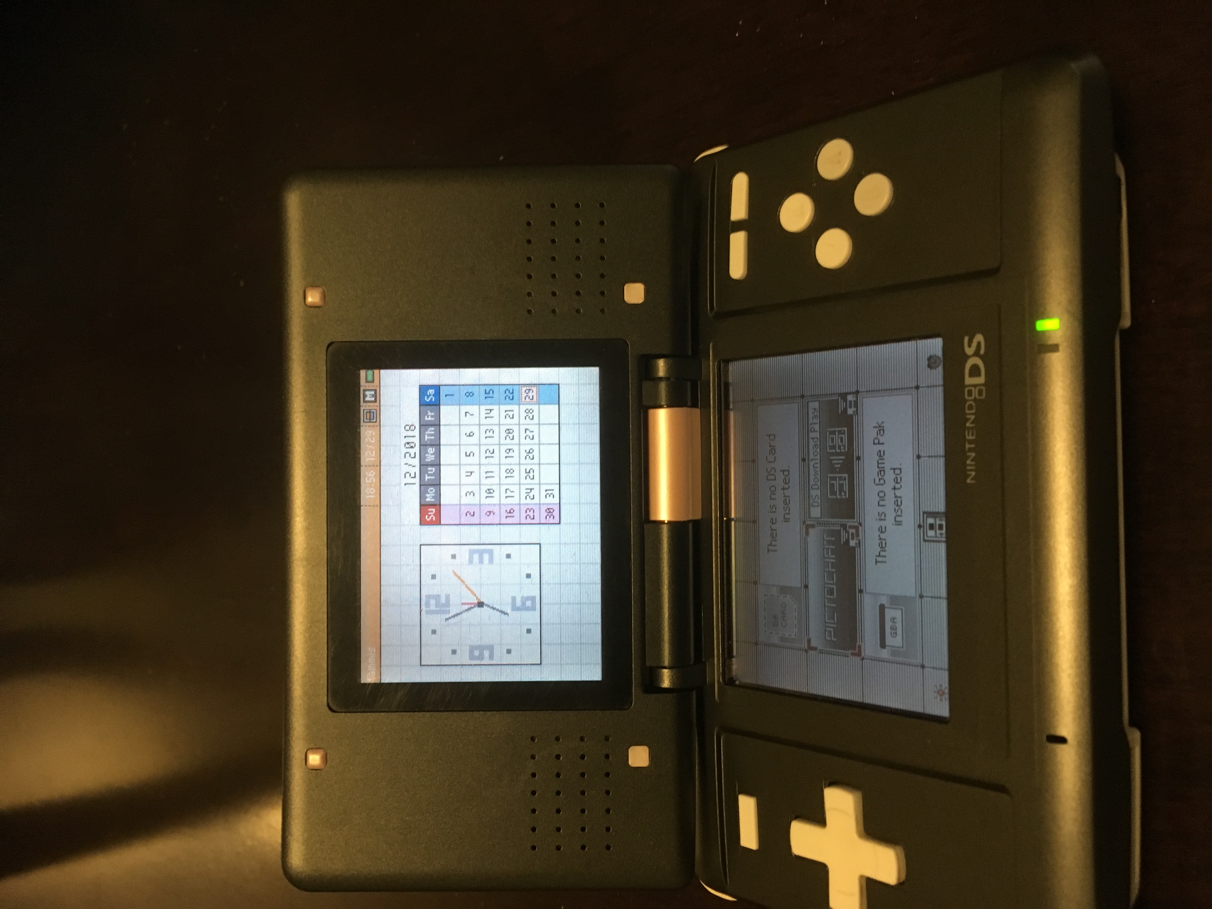repaired console turned on displaying the Nintendo DS main menu