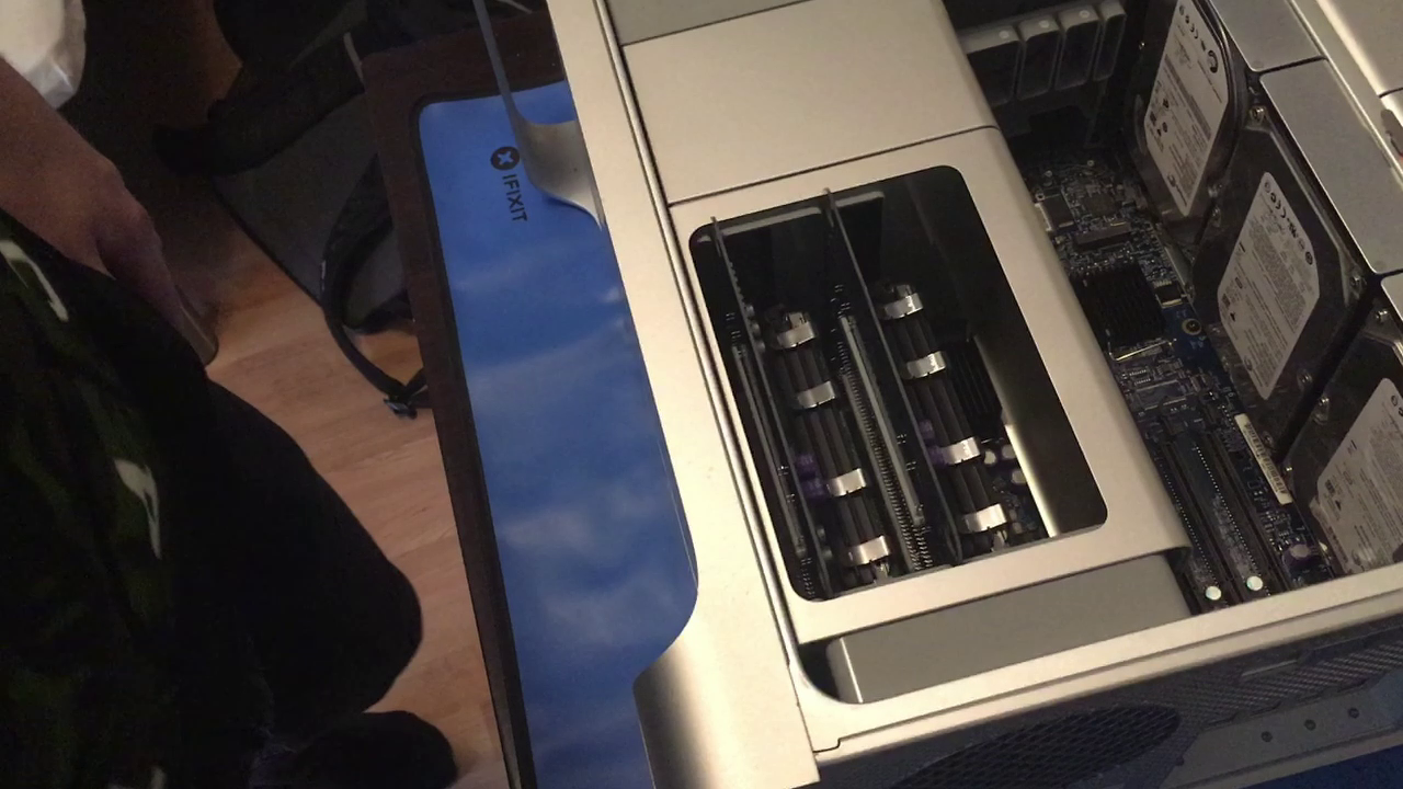 the first machine with its side panel removed