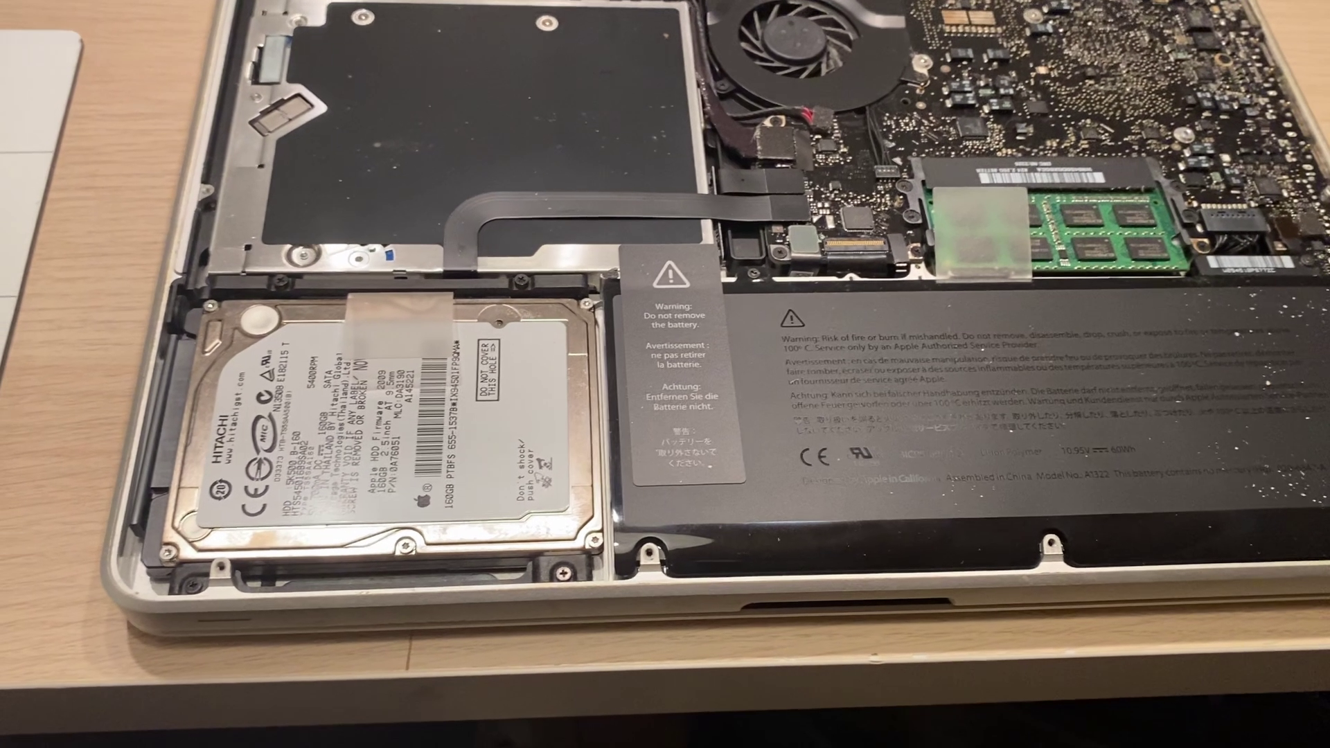 the Macbook with the bottom cover removed