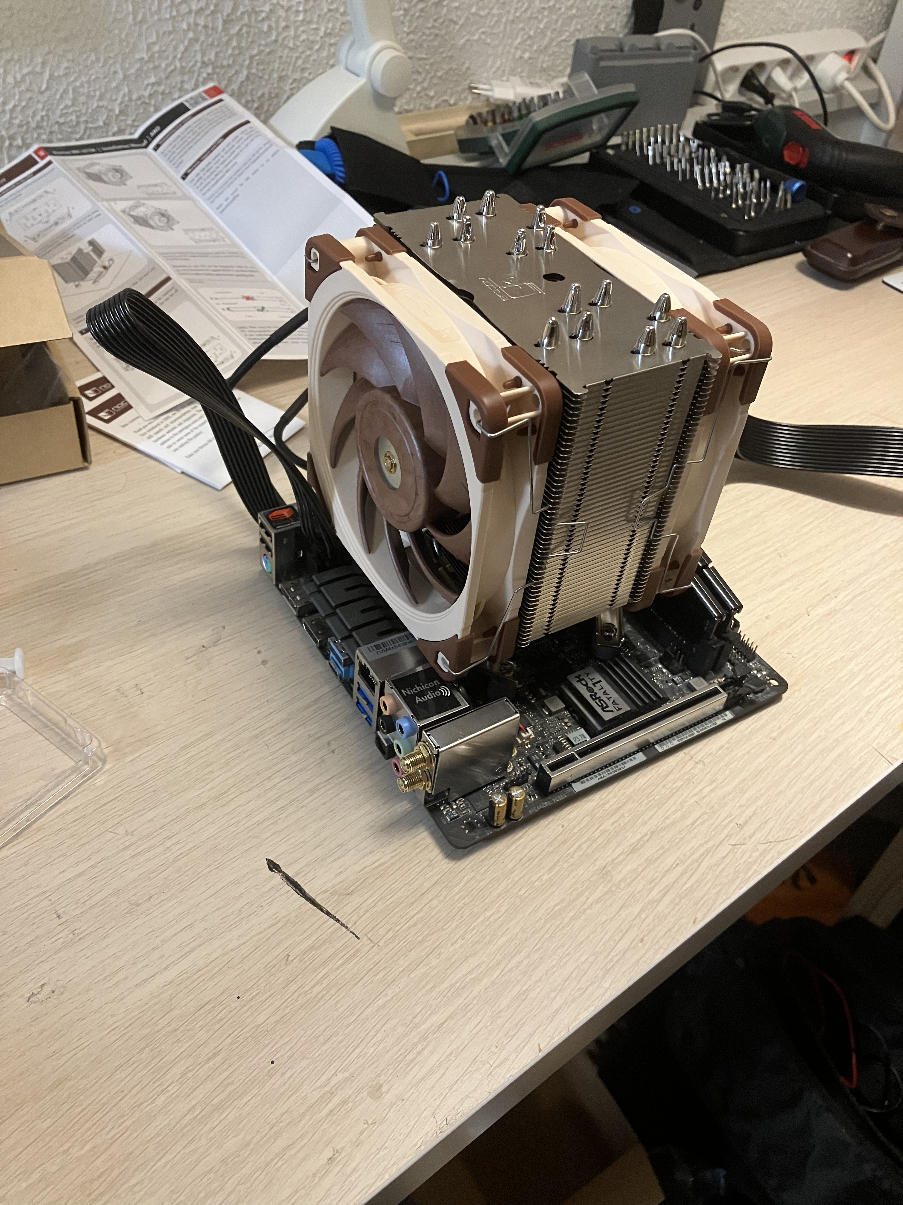 the motherboard with the new CPU and CPU cooler