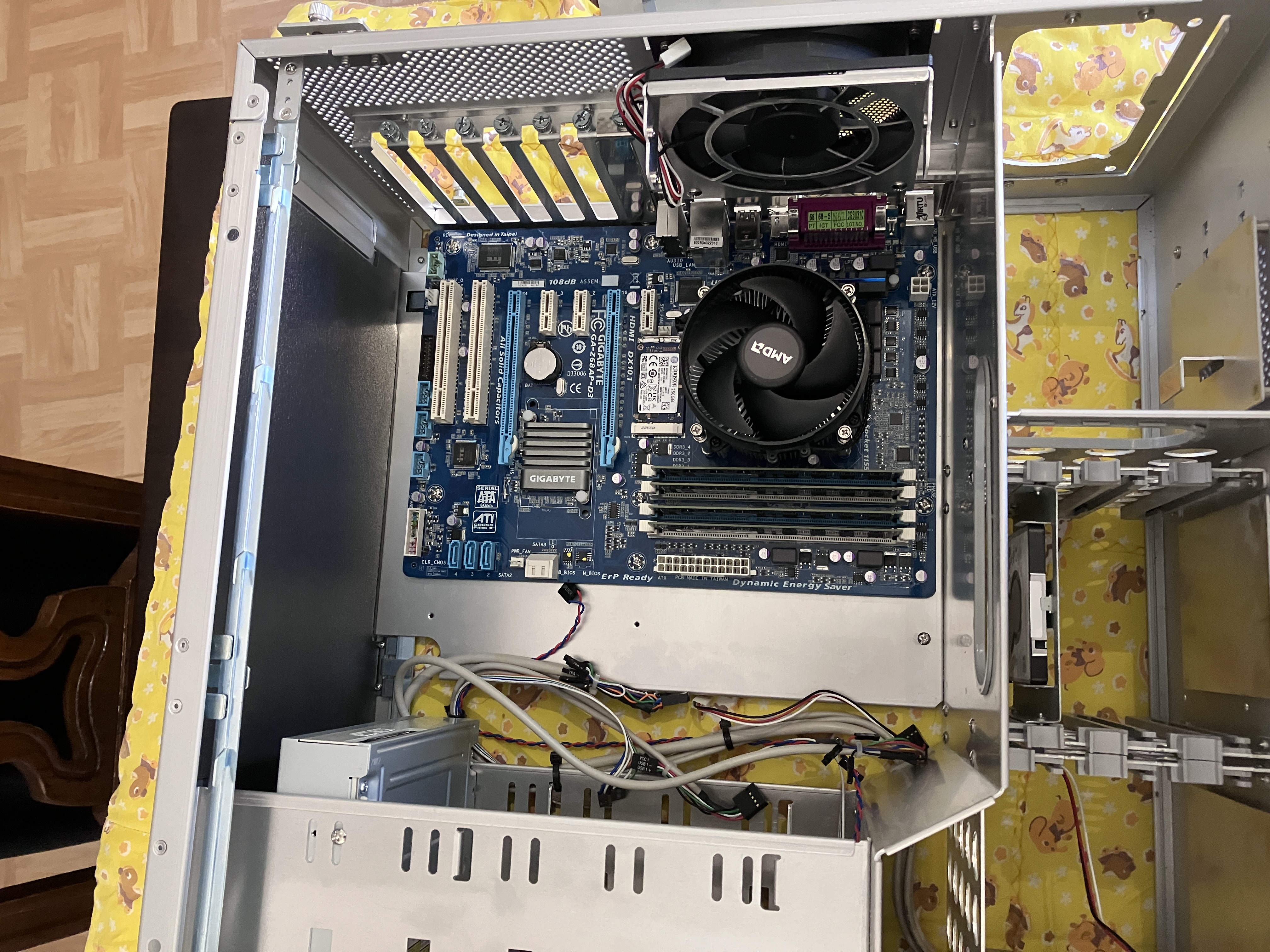 the motherboard upside down on the left wall of the case